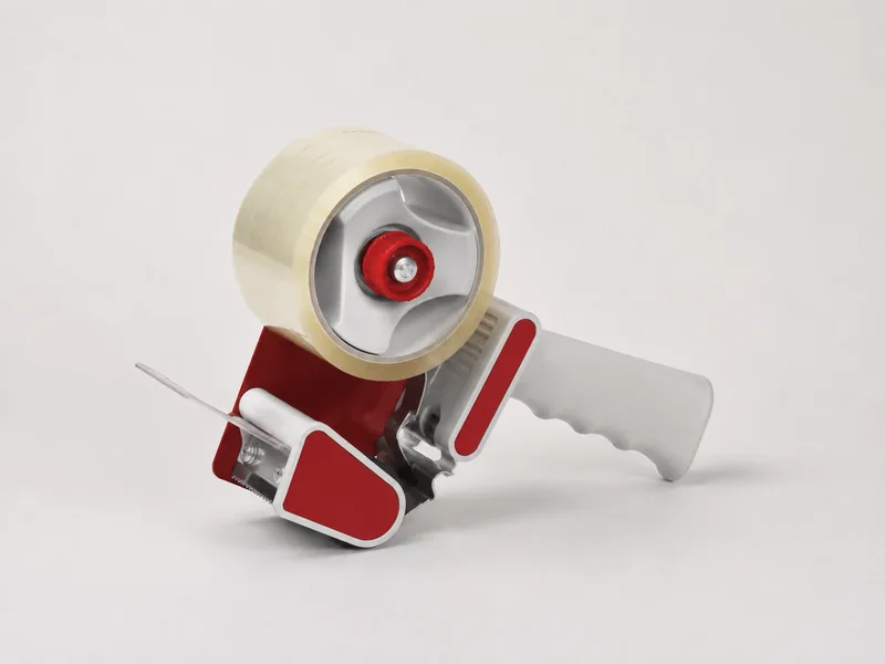 Packing tape hand dispenser shown as a realistic illustrative studio image